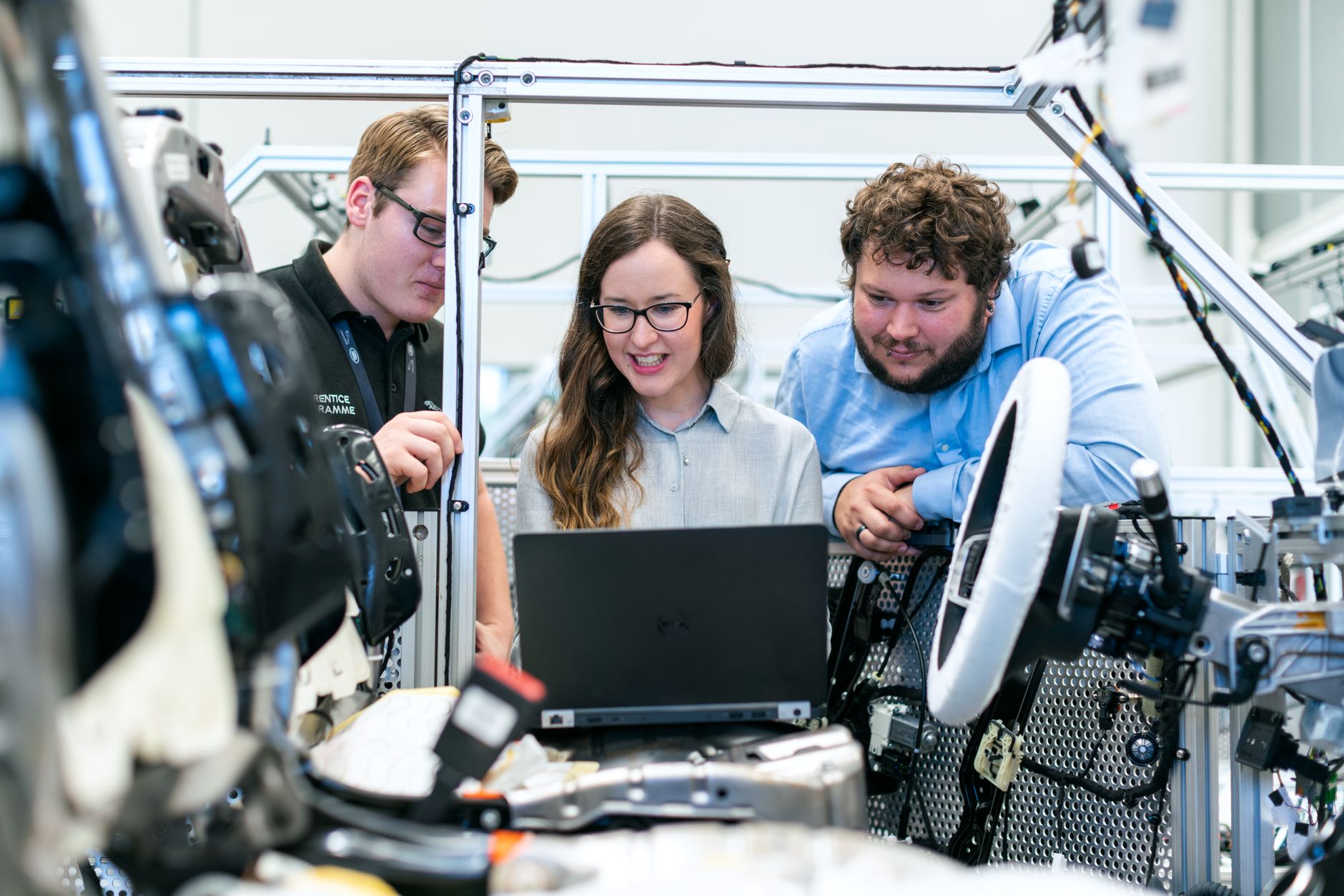 Instructor demonstrating shaft alignment technique to technicians
