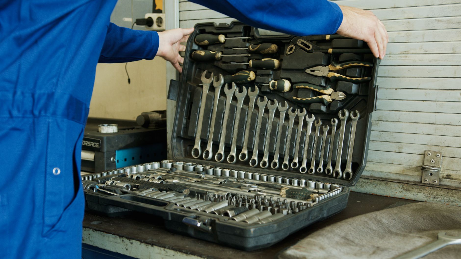 Technician tightening coupling bolts on rotating equipment