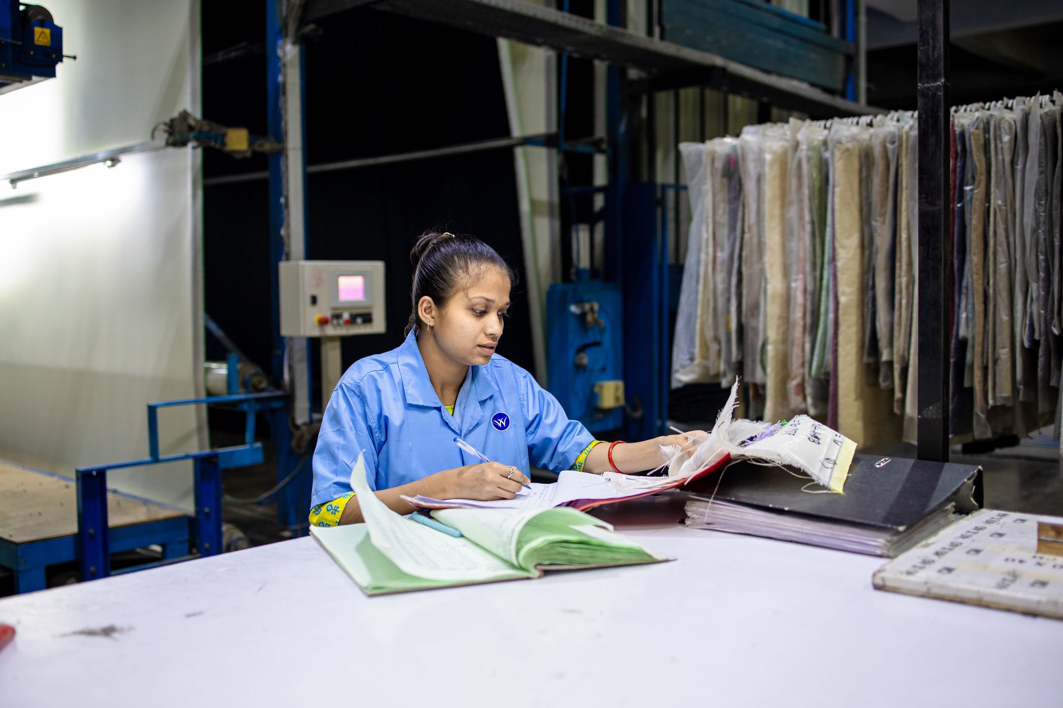 Quality auditor reviewing a production process