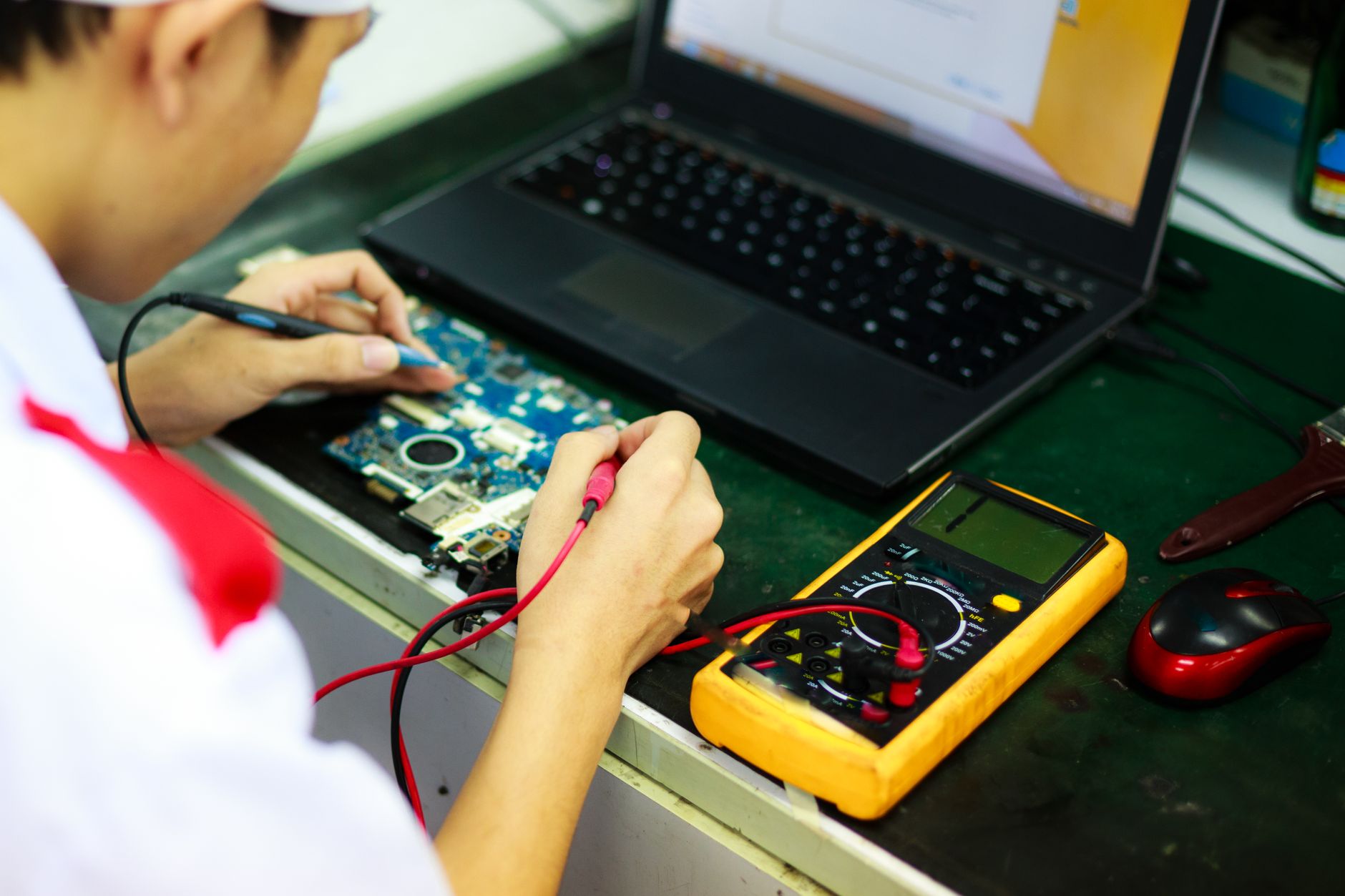 Technician analyzing vibration data on a laptop