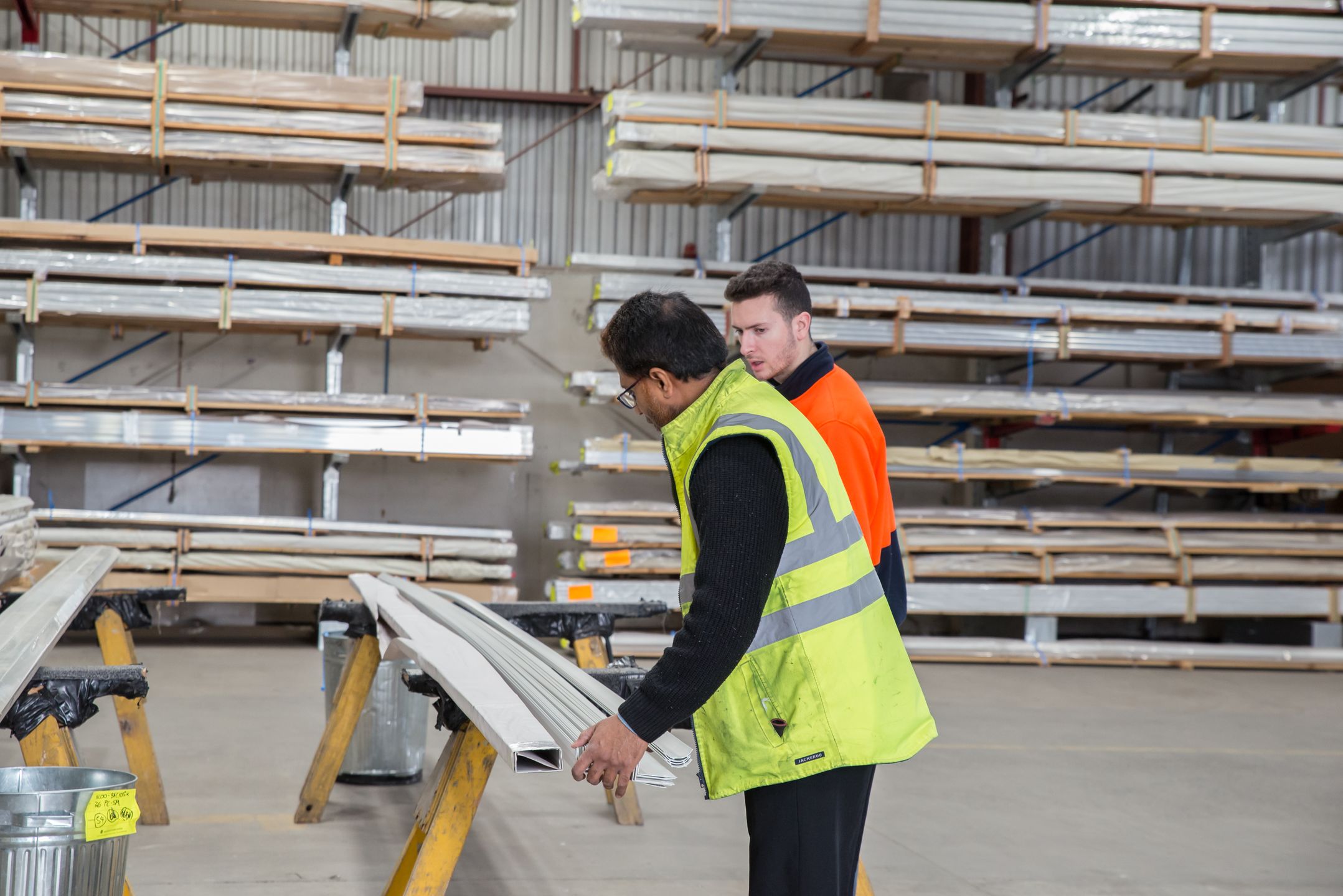 Team reviewing materials in a warehouse